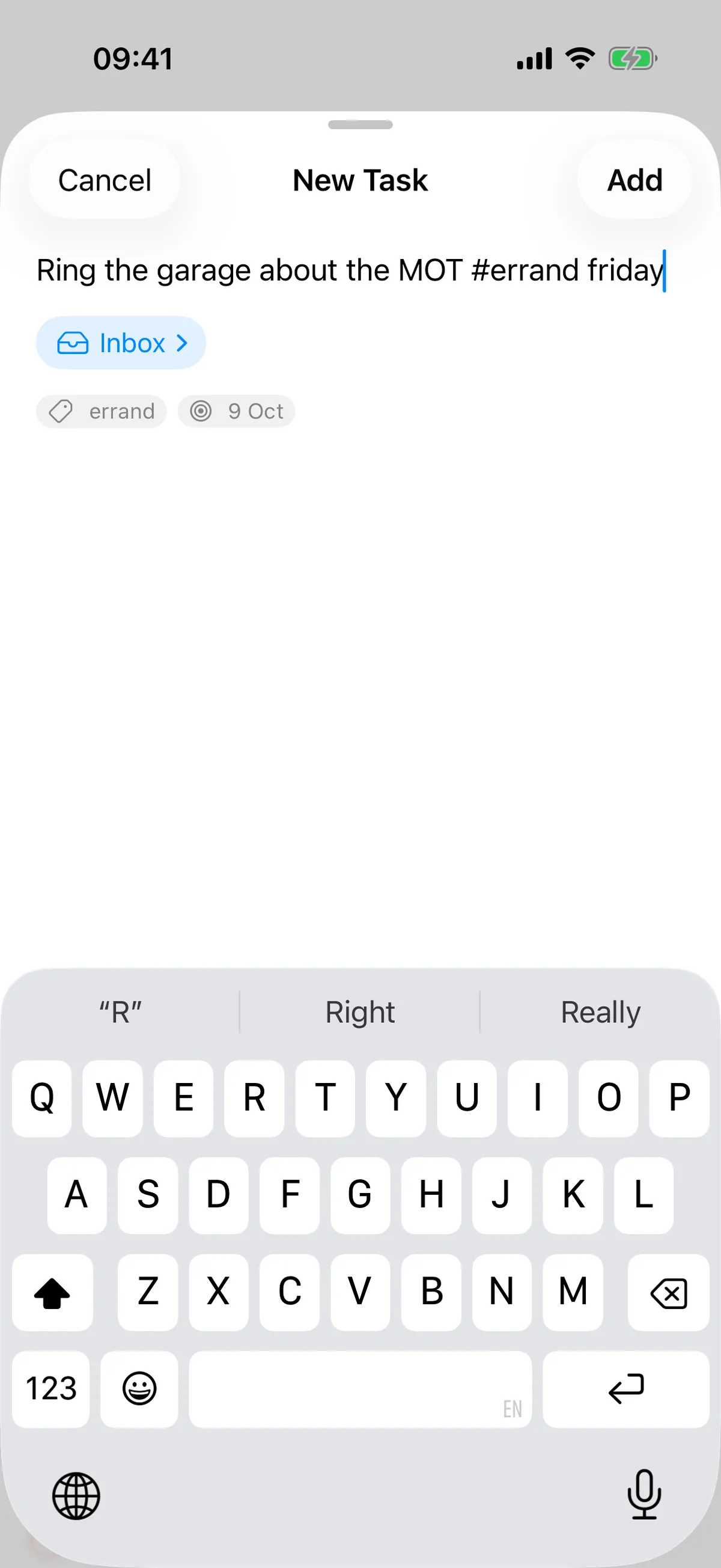 The New Task sheet on an iPhone with 'Ring the garage about the MOT #errand friday' typed in.